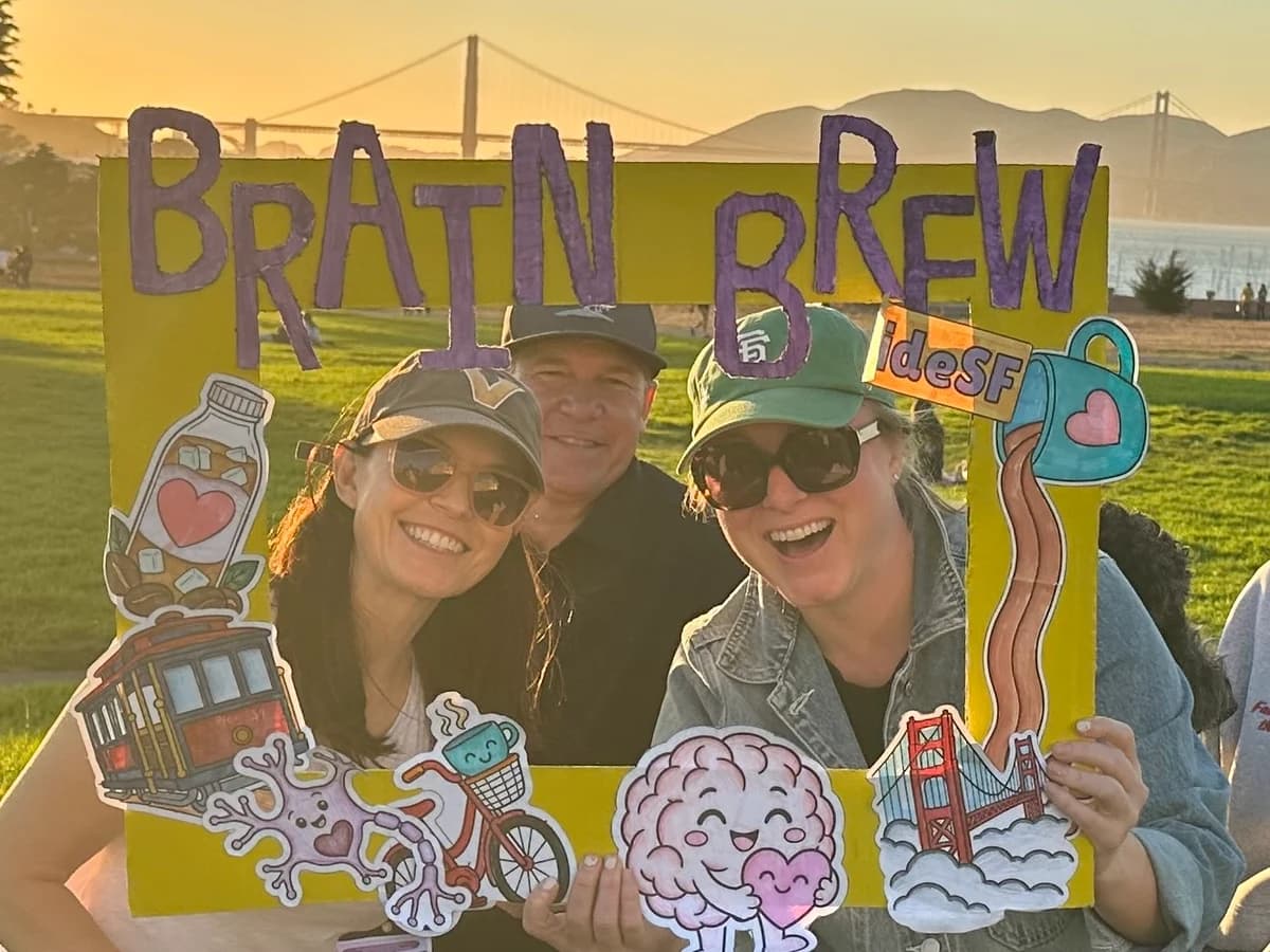 A group sharing a sunset moment in the Brain Brew photo frame